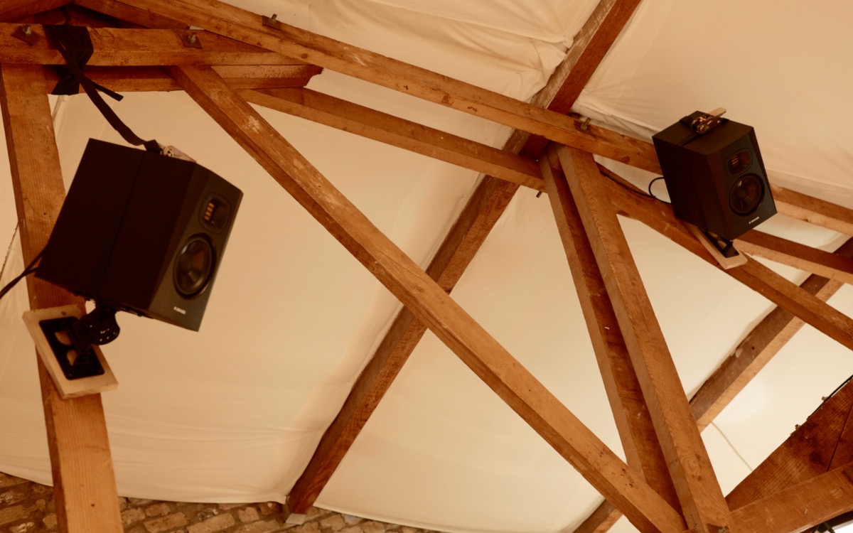 Adam Audio spatial array mounted in the exposed roof beams