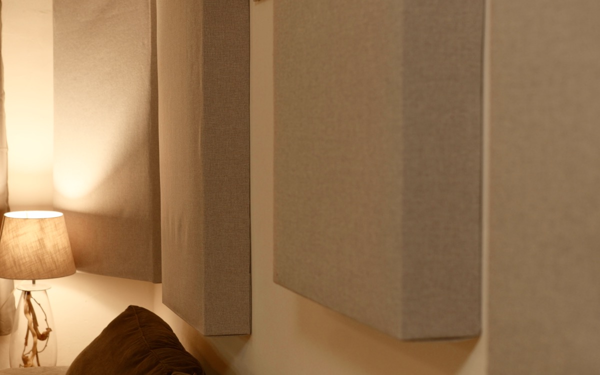 Recycled-denim panel absorbers on the wall of the listening room